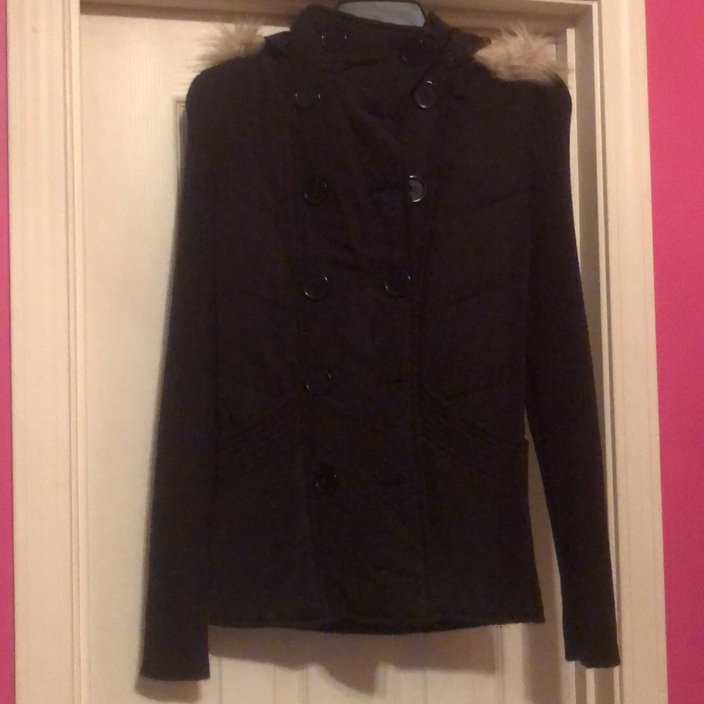 A jacket that has a vest sewed on top of it.